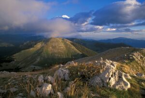 Sunset view of mountain ridges in the Central Apenines rewilding landscape, Italy.