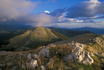 Sunset view of mountain ridges in the Central Apennines rewilding area in Italy.