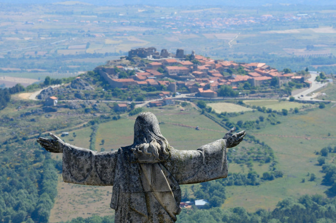 Castelo Rodrigo village, Portugal, with the statue of Christ redentor in front.