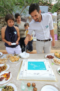 Pedro cutting the cake at the 15th anniversary of Associação Transumância e Natureza (ATN).