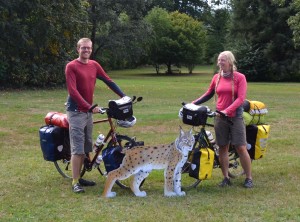 Dave and Anna next to a wooden model of Euroasian lynx at the Biosphere Reserve Palatinate Forest, Germany.