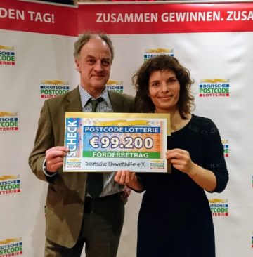 Ulrich Stöcker, head of the Oder Delta rewilding team on the German side of the delta and Gaby Schneider, Marketing Expert at DUH., receive a cheque at the German Postcode Lottery gala event in Wuppertal on January 29, 2019.