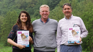 Wiet de Bruijn, Chairman of the Board of Rewilding Europe (right), and Aleksandrina Mitseva, board member (left), receive the first copies of the Annual Review from Rewilding Europe Managing Director Frans Schepers (centre).