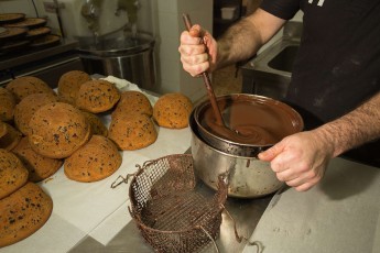 Preparation of traditional Parrozzo/Pan dell'Orso (Bear's bread) cake with chocolate and almonds made by Piero Testa in "Delizia degli Elfi" bakery in Pescasseroli. Central Apennines, Abruzzo, Italy. Aug 2014