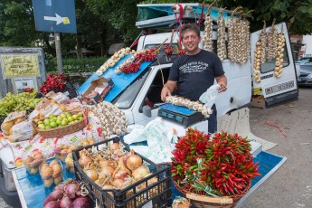 Street vendor of vegetables, peppers and local "red" garlic in Pescasseroli. Central Apennines, Abruzzo, Italy. Aug 2014