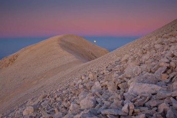 Full-moon and sunset colors on summit of Mount Acquaviva (2707 m), second highest peak in the Majella massif in the Majella National Park