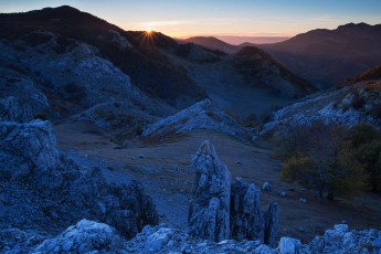 Sunset over the mountains overlooking the Crovu Porcului (Pig valley), Mehedinti plateau geopark, Romania