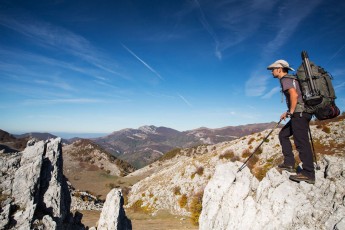 Hiker (Dan Dinu) on limestone ridge in Mehedinti Plateau Geopark, Geoparcul Platoul Mehedin?i, Romania.