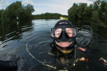 A pool frog (Pelophylax lessonae) joins underwater photographer Magnus Lundgren