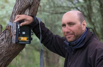 Razvan Crimschi, from the Danube Delta rewilding team, sets up wildlife cameras to record the presence and behaviour of jackals.