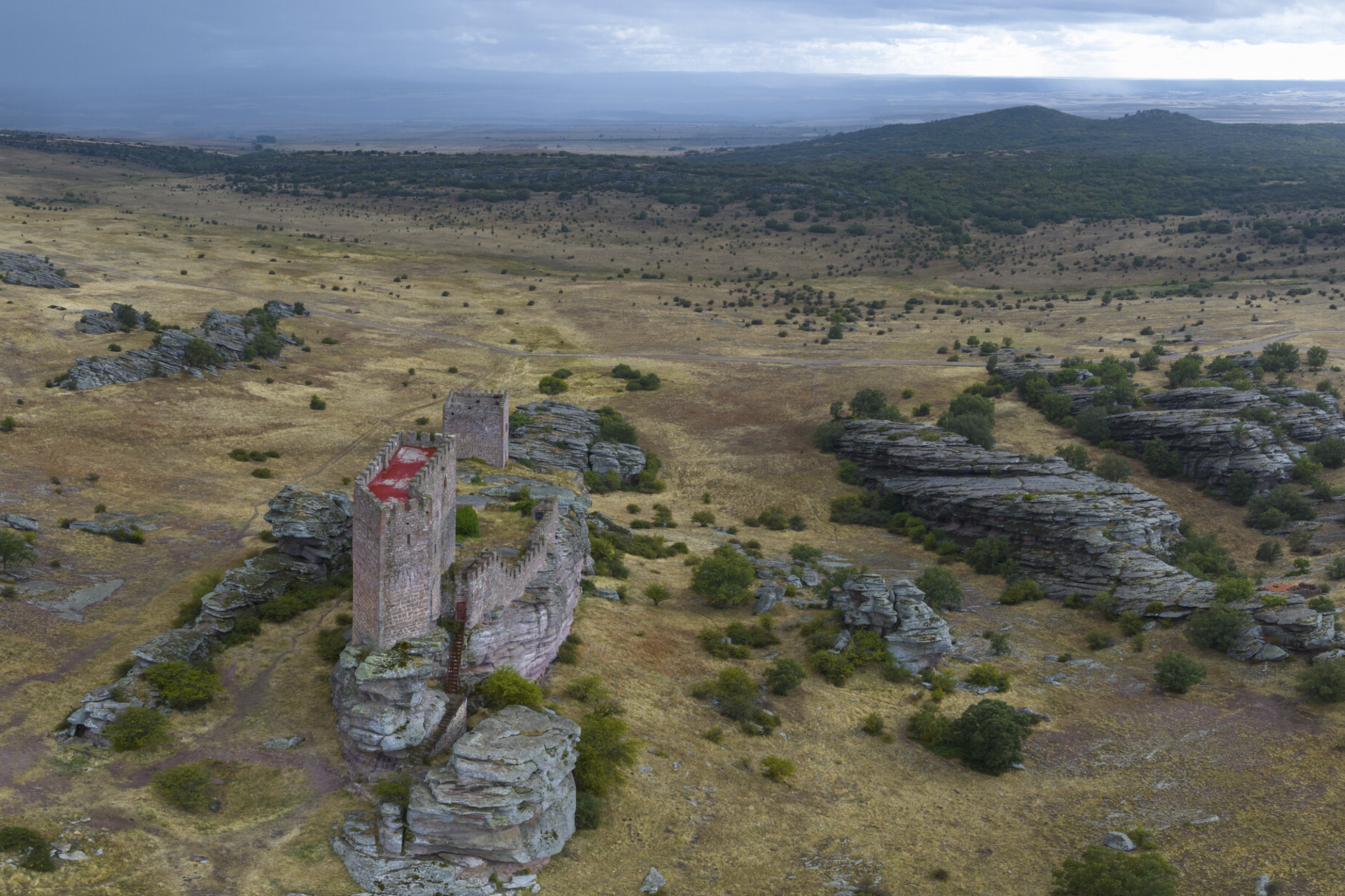 Sunset over the Castle of Zafra and the Sierra de Caldederos.