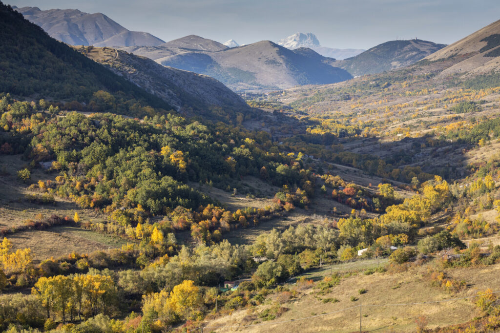 Ortona dei Marsi in the Abruzzo, Lazio and Molise National Park with view into near Rewilding priority area number 1. Central Apennines, Italy. October 2020.
