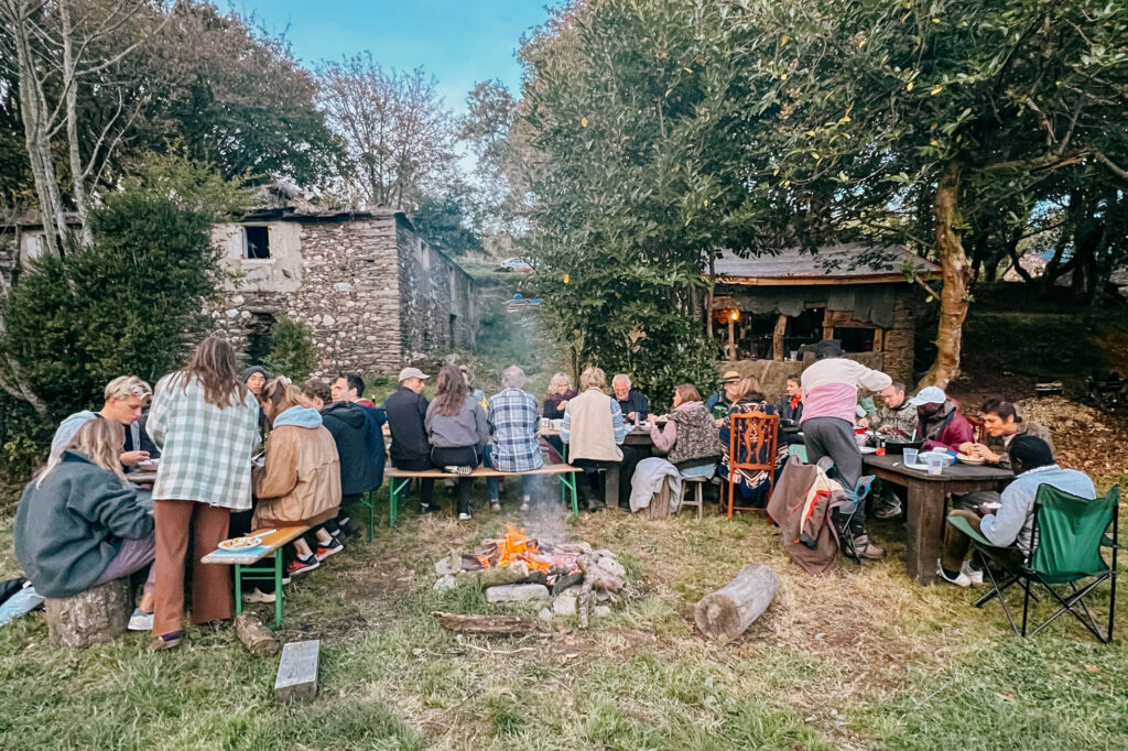 Young rewilders having a shared meal in rural Spain (Galicia)